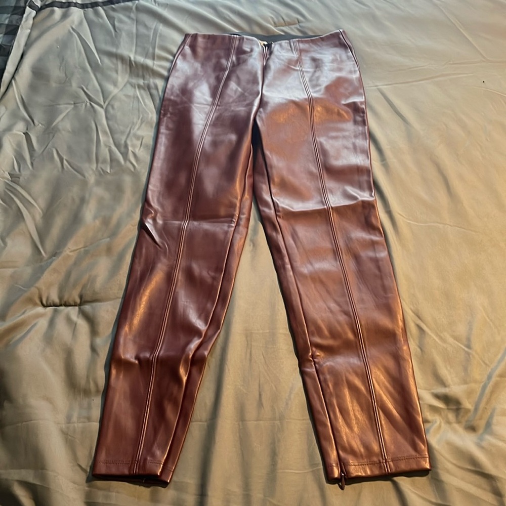 Burgundy leggings with zippers on the side
